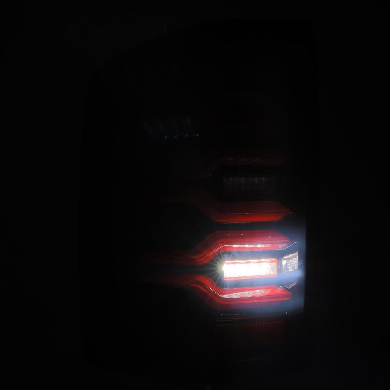 AlphaRex 14-18 GMC Sierra 1500/2500HD/3500HD LUXX-Series LED Tail Lights Blk/Red w/Actv Lgt Seq. Sig 630050