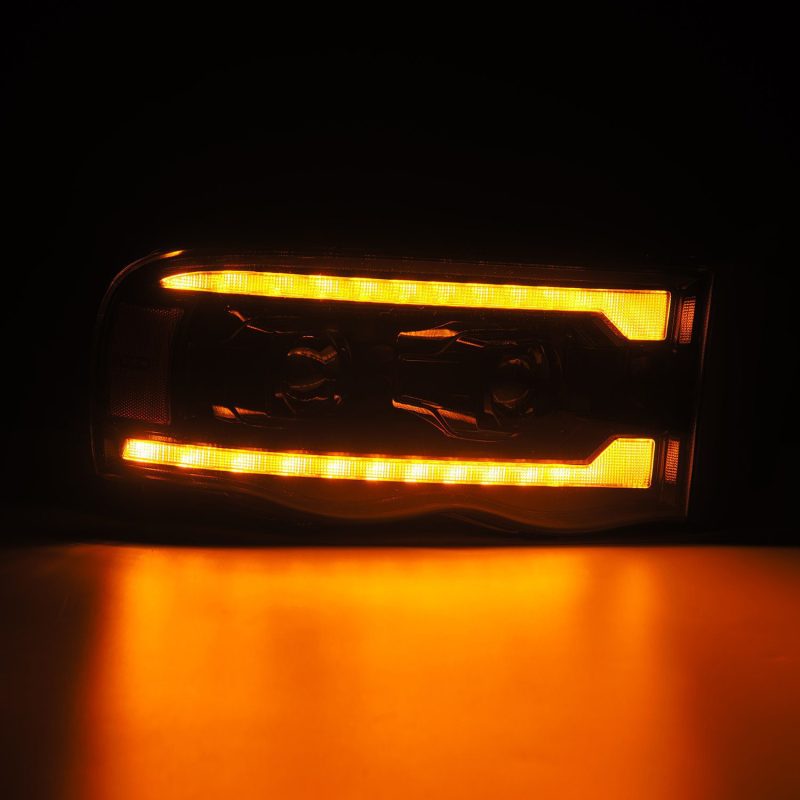 AlphaRex 02-05 Dodge Ram 1500 PRO-Series Projector Headlights Plank Style Alpha Black w/Seq Signal 880572