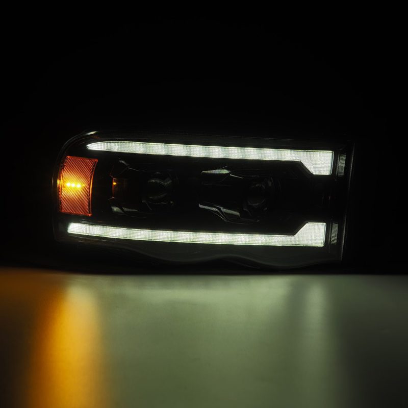 AlphaRex 02-05 Dodge Ram 1500 PRO-Series Projector Headlights Plank Style Alpha Black w/Seq Signal 880572