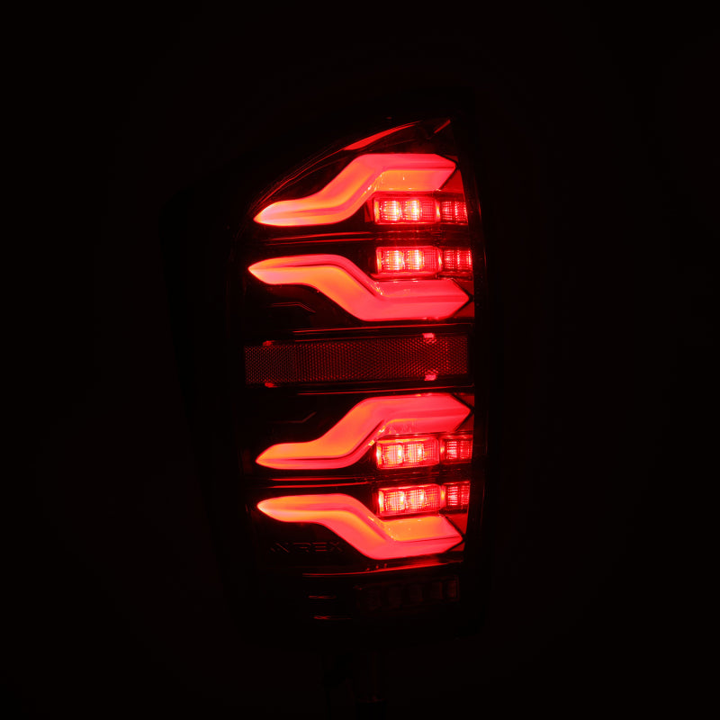 AlphaRex 16-21 Toyota Tacoma LUXX LED Taillights Alpha Blk w/Activ Light/Seq Signal 680080